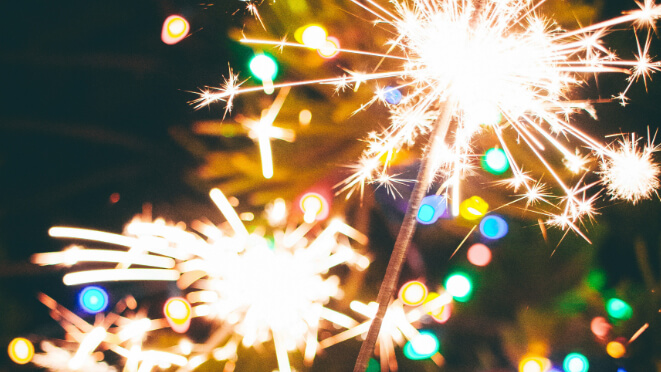 Sparklers with a black sky behind them