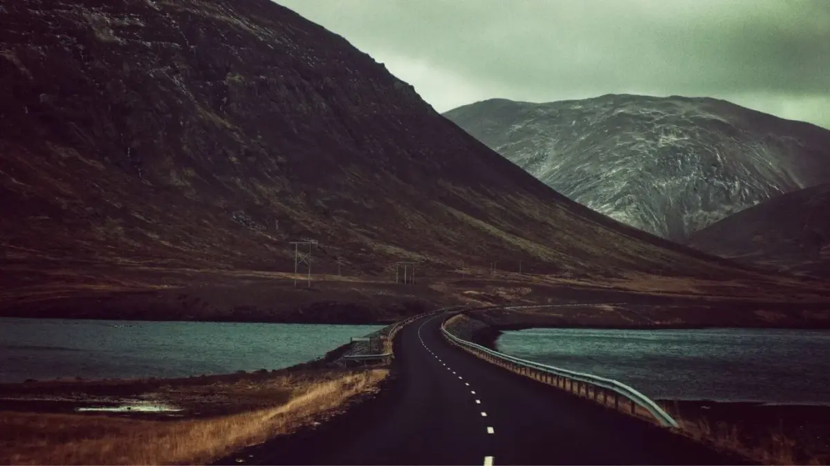 A paved road winding through the mountains